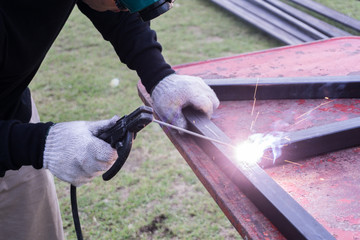 Welders welding steel