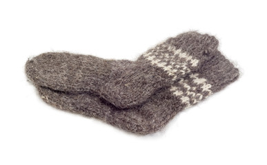 Fototapeta na wymiar Thick wool hand-knitted socks on a white background