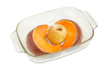 Baked pieces of pumpkin and apple in glass casserole pan