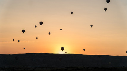 silhouettes of hot air balloons in Cappadocia, Turkey