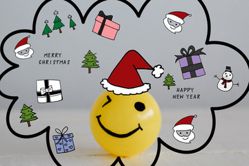 Self made Hand drawn Smiley face yellow ball with Christmas doodles