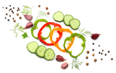 mix of sliced cucumber, garlic, sweet bell pepper and parsley isolated on white background. top view