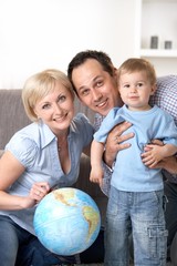 Fototapeta na wymiar Happy family with globe