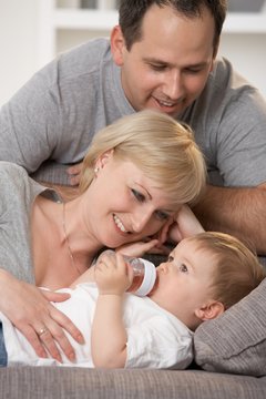 Happy caucasian family with little baby