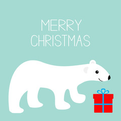 Merry Christmas text. Arctic polar bear cub. Gift box present. Cute cartoon baby character. Red giftbox with bow. Greeting card. Flat design. Blue winter background.
