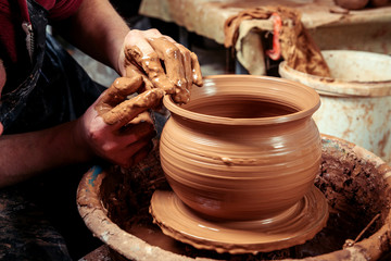 Potter at work. Workshop.
