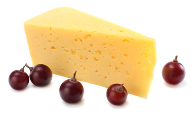 piece of cheese with grapes isolated on white background