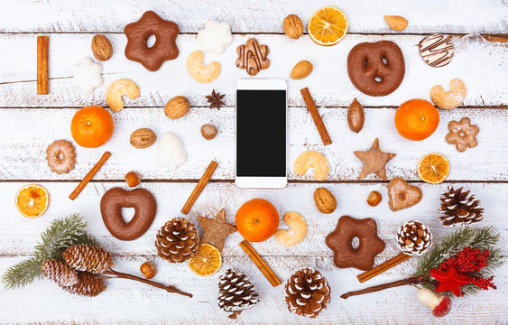 Christmas Food Flat Lay With Smart Phone On White Table