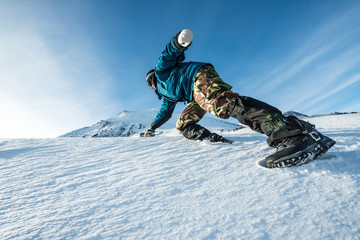 climber with an ice ax climb on the snowy mountain