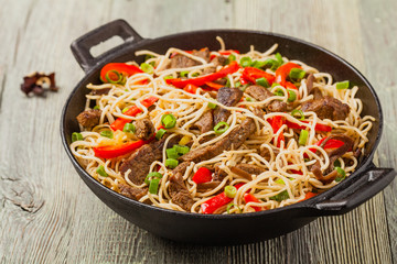 Chinese pasta with beef. Prepared in wok.
