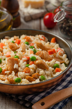 Delicious risotto with chicken and green peas.