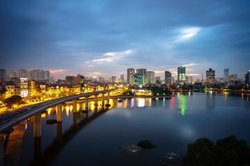 Naklejka premium Aerial skyline view of Hanoi. Hanoi cityscape at twilight at Hoang Cau lake