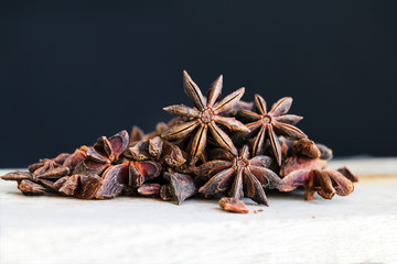 Anise star spice - pile closeup. Copy space. Selective focus.