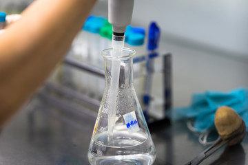Scientist doing chemical test in laboratory