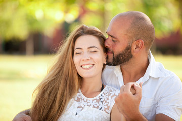 Fototapeta premium Happy Couple is Embracing Outdoors in Summer