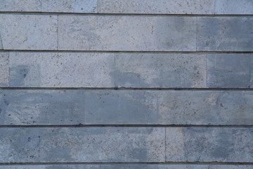 Fragment of the stone wall with a flat pattern. Horizontal frame