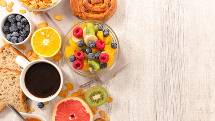 fruit salad,coffee and croissant