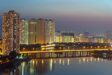 Aerial skyline view of Hanoi cityscape at sunset at Linh Dam lake