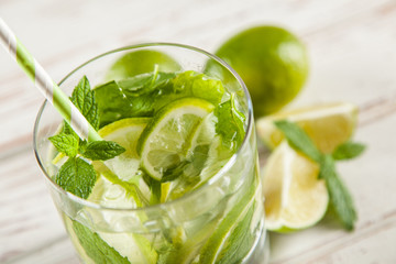 Mojito cocktail on white wood background