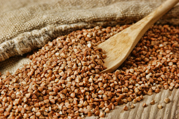 buckwheat groats and wooden spoon