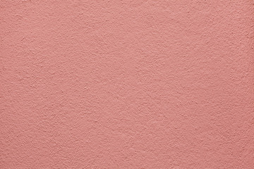 Fototapeta premium Pink painted stucco wall. Background texture