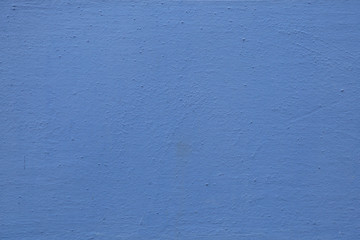 Blue painted stucco wall. Background texture
