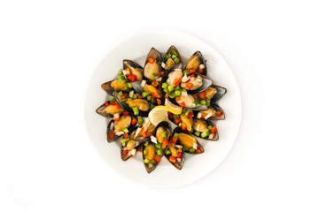 Steamed mussels with peppers and onion isolated on white background.Top view

