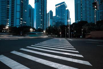 Empty road surface with city landmark buildings of evening