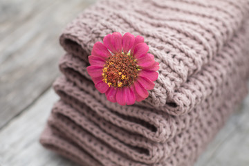 Stack Folded Knitted Crochet Cotton Wool Warm Winter Cozy Things Gentel Creamy Coffe Tones Colors Natural knitting background Pink Flower Decor Pile Concept