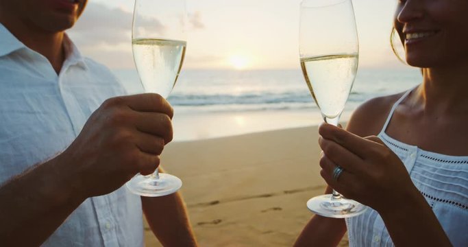 Couple Drinking Champagne at Sunset