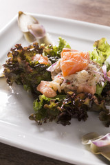 Salmon ceviche, crab and salad with artichoke