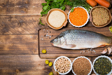 Healthy food ingredients for cooking concept diet fresh raw fish with vegetables and grains
