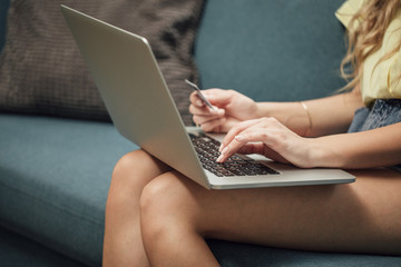 Woman Using Credit Card for Online Payment