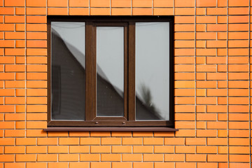 window in a red brick house