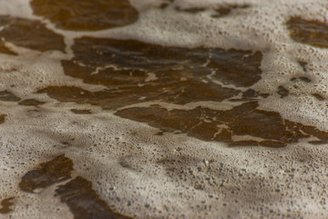Fototapeta na wymiar close up of the sea water affecting the sand on the beach, sea waves calmly flowing sand, relaxing view