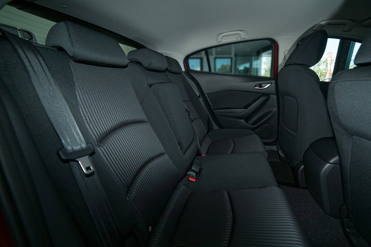 Modern Car Interior With Back Seat, Front Seats And Belts