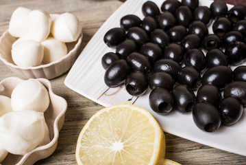 Black olives, lemon slice and mozzarella cheese