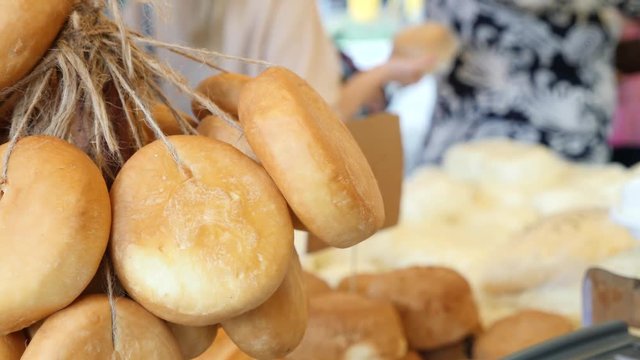 smoked cheese on the counter in the bazaar. 4k.
