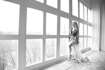 A beautiful balerina near the window. © aleksashka_89