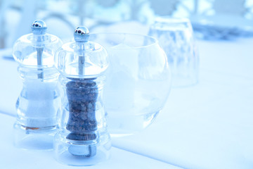 salt and pepper on a table.