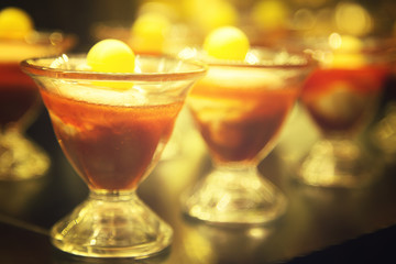 Tasty dessert in a high glass bowl