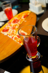 Fruit tea with strawberry in turkish glass cup