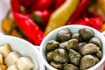 Bowl of capers, italian antipasti, traditional food from italy or mediterranean cuisine ingredient