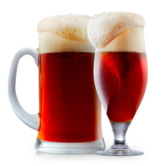 Mug of frosty dark red beer with foam isolated on a white background