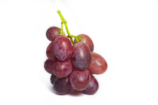 Ripe red grape with bunch isolated on white background