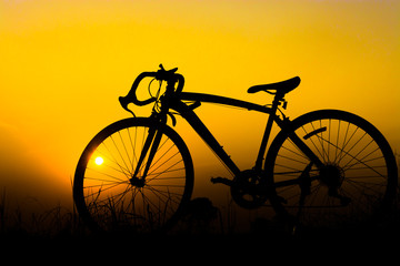 Fototapeta na wymiar Silhouette bicycle on sunset.
