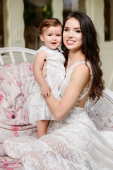 Mom and child in amazing dresses outdoor