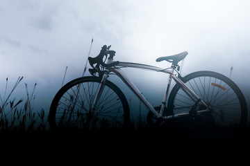 Fototapeta na wymiar bicycle in fog on morning.