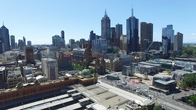 aerial drone flying into Melbourne federation square skyline Australia city 4k