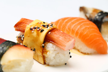 assorted sushi on white plate isolated on white back ground